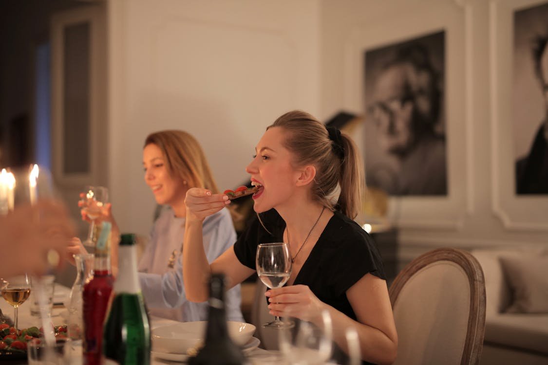 Free Woman in Black Shirt Holding Wine Glass Stock Photo